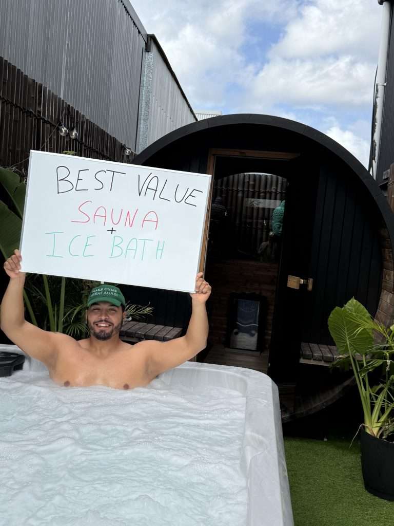 One of Strength Sanctuary's Brisbane gym members holding a sign.
